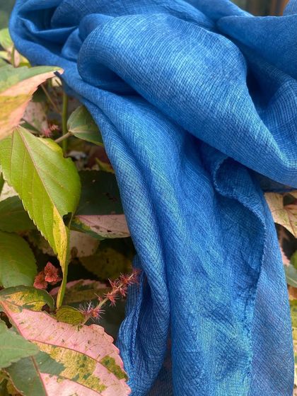 A luxurious Kota silk stole dyed with natural indigo. The deep blue color and the subtle texture of the silk make this a timeless and elegant accessory.