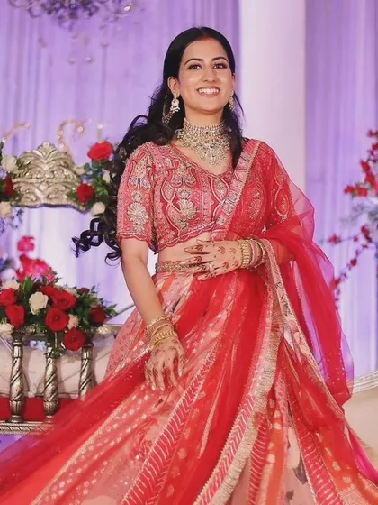 A full-length shot of Shivani, showing her beautiful smile and elegant attire for the naming ceremony.