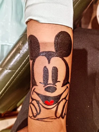 Classic cartoon characters are always a hit. Here is a hand painted Mickey Mouse, bringing a bit of Disney magic to the party.