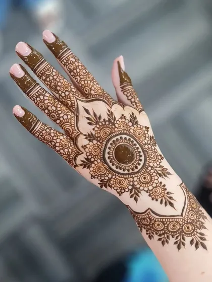 A close-up of the central mandala, showcasing the fine lines and dot work that make the design pop.