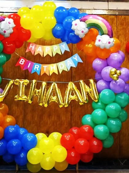A vibrant, rainbow-colored balloon ring for Vihaan's birthday. This cheerful and colorful decoration is perfect for bringing a burst of joy to any home celebration.