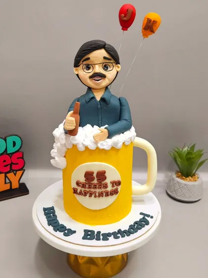 Cheers to 55 years! This beer mug cake, complete with a custom fondant figurine of the birthday man, was a fun recreation of an AI image sent by the client.