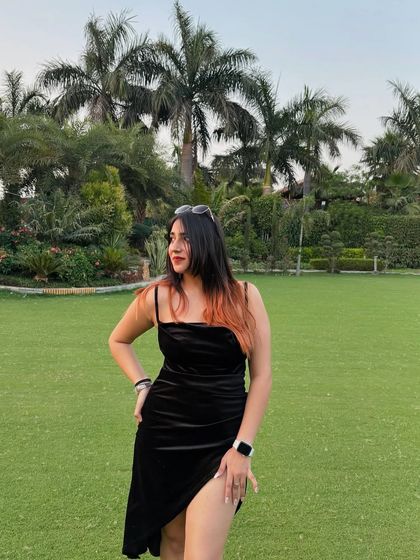 A full-length shot of my black velvet birthday dress from NewMe. This is a great example of a chic and modern party dress.