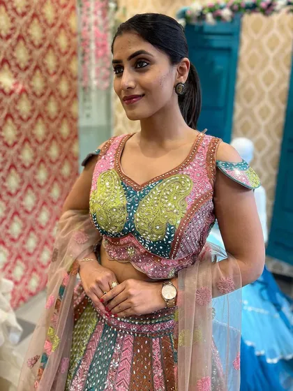 A close-up of the hand-embroidered blouse of our exclusive lehenga, as worn by actress Chandna Gowda.