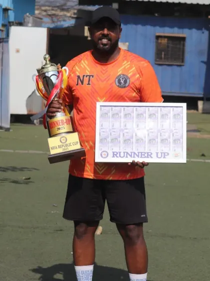 Our team manager with the runner-up trophy and prize money from the MFA Republic Cup.