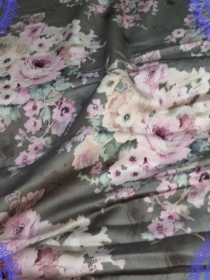 A beautiful digital floral print on a grey base. This soft fabric is ideal for creating elegant dresses or kurtis with a modern, romantic feel.