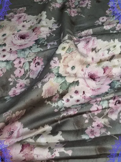 A beautiful grey fabric with a soft pink floral digital print. The elegant design and smooth texture make it ideal for creating sophisticated dresses and tops.