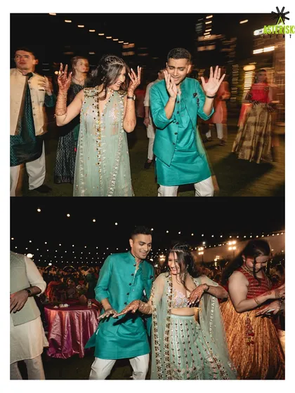 It's all about the candid moments. We make sure the bride, groom, and all their guests are lost in the celebration, like this couple sharing a dance during their vibrant Mehendi night.