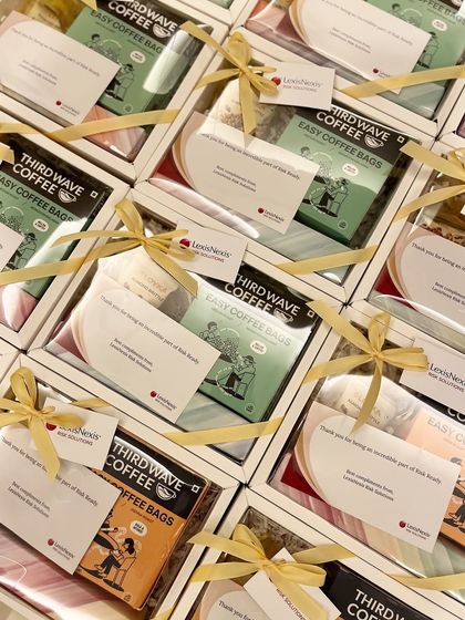 An overhead shot of the LexisNexis coffee hampers, showing the consistent branding and beautiful presentation across the entire bulk order.