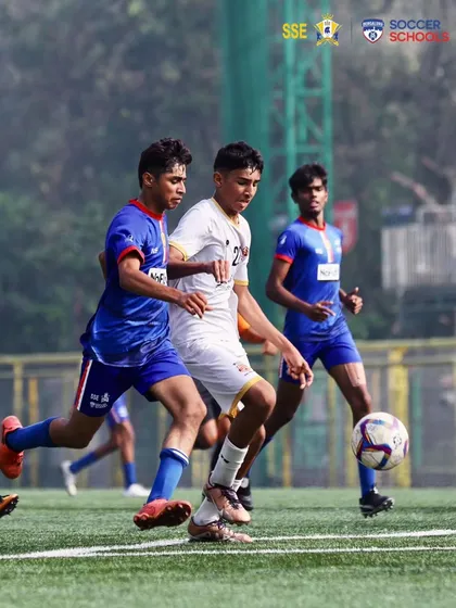 Two players in a tight duel for the ball. These competitive moments in the AIFF Youth League are where our players' training is put to the test.