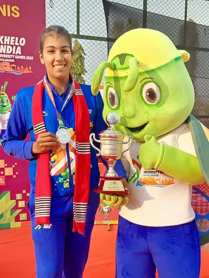 Kashish Bhatia proudly displays her silver medal and runner-up trophy at the Khelo India University Games in Guwahati.