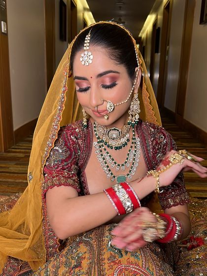 A moment of quiet reflection. With her eyes closed, you can see the beautiful blend of pink and gold eyeshadow that we created for her.