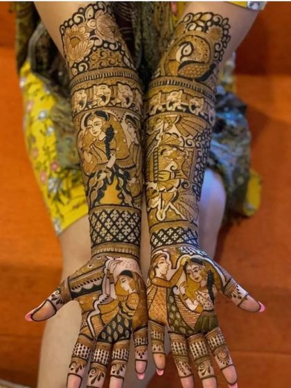 This design is a canvas of stories, with multiple scenes from a couple's life and wedding ceremonies covering the hands and arms.