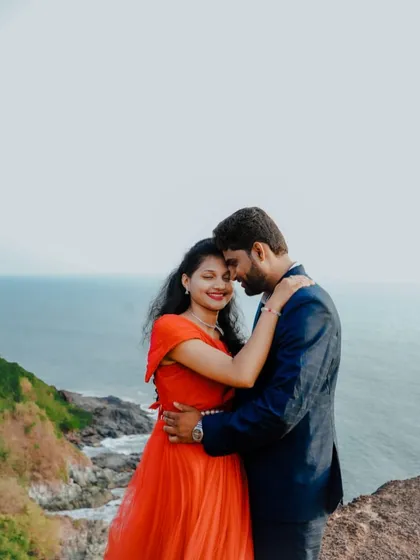An intimate and happy moment between a couple during their pre-wedding shoot. The red gown adds warmth and passion to the photo.