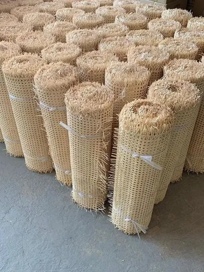 A view of our warehouse stock of export-grade cane webbing rolls. We supply these materials in bulk for large-scale interior projects, including custom wall paneling, cabinet inserts, and furniture manufacturing for our B2B clients.