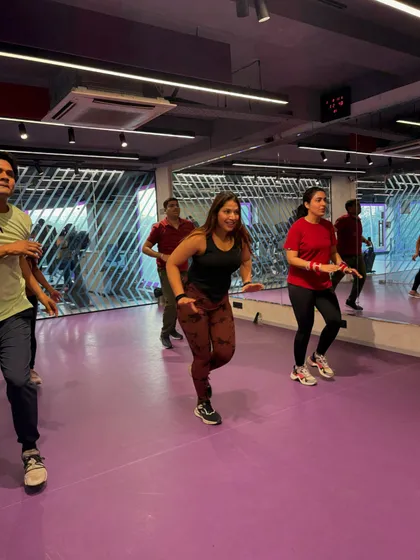 In sync and having a blast. This photo shows my clients following along with a fun, choreographed dance fitness routine.