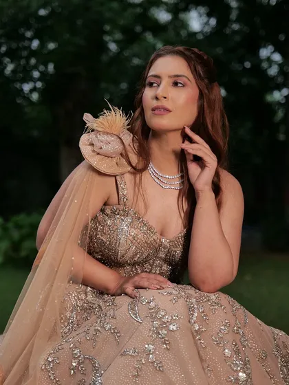 A fairytale look for your special day. This embellished gown with a unique shoulder detail is a dream come true, and it's available for rent.