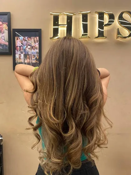 The back of a client's long hair with a fresh color treatment, perfect for a new year, new vibe.