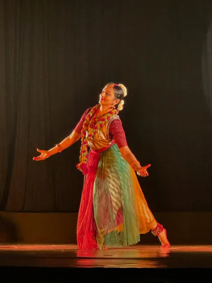 A photo from "Sharad" where the costume, with its flowing, multi-colored skirt, was designed to represent the changing colors of autumn leaves.