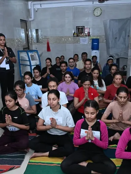 A group of our volunteers and participants in a moment of prayer, reflecting the mindful and devotional atmosphere of our events.