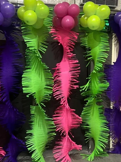 This unique textured backdrop in neon colors was part of our gymnastics party decor, creating a great photo wall.