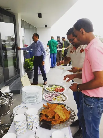 Guests enjoying the food at an outdoor corporate lunch. My goal is always to see happy faces and satisfied appetites at every event I cater.