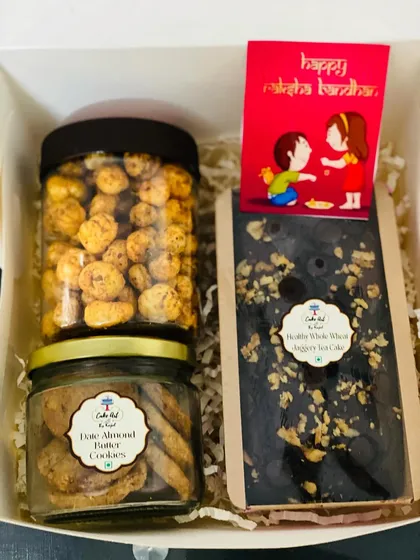 This hamper is perfect for those who love variety. It pairs a wholewheat jaggery chocolate cake with two jars of my other healthy snacks: date and almond butter cookies and a dry fruit trail mix.