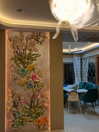 This vertical floral wall mural was created for a living room, adding a touch of nature's elegance. The 3D flowers are individually sculpted and painted.