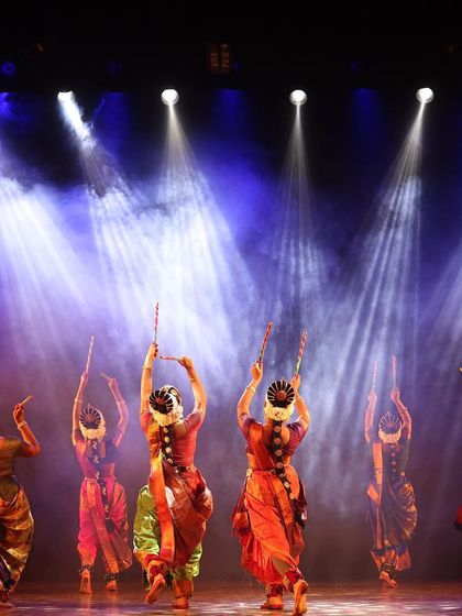 A glimpse of our dancers from behind during a dandiya raas sequence in "KRISHNA". The synchronized movements and traditional hairstyles with flowers create a beautiful and authentic visual.