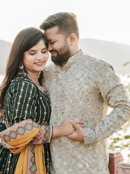A close-up portrait capturing the gentle intimacy between a couple during their golden hour shoot at Jal Mahal.