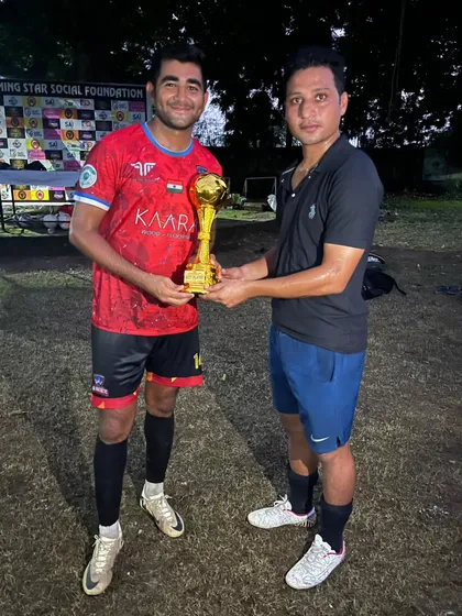 Our player receiving the Top Scorer award at the Dwarka 8v8 Championship.