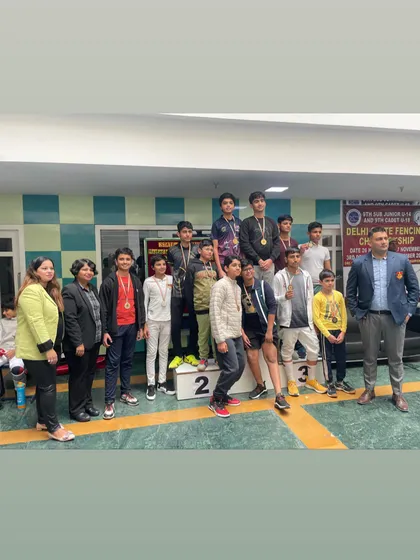 A full view of the U-14 and U-18 boys' podium, surrounded by coaches and officials at the Delhi State Championship.