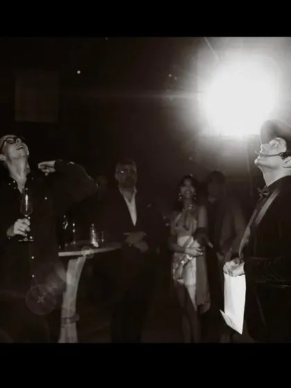 A dramatic, black and white shot of a guest looking up in awe. Sometimes the magic is grand and theatrical.