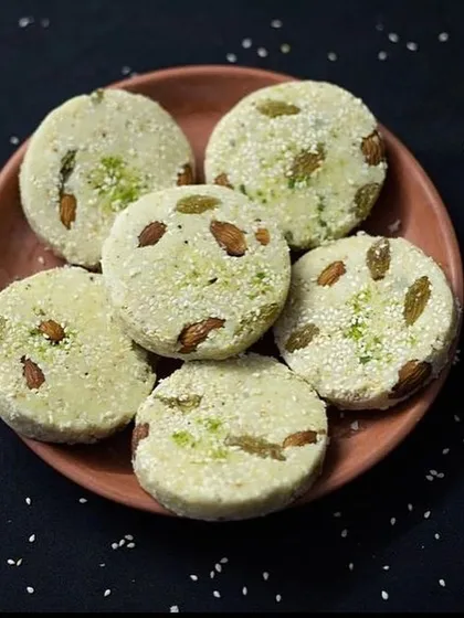A close-up of our Til Gajjak, loaded with almonds and raisins. This traditional winter sweet is both healthy and delicious.