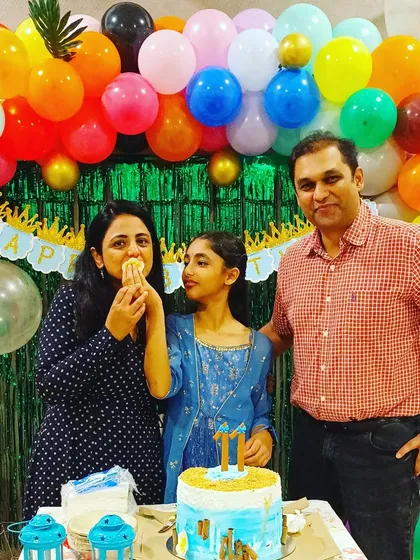 A candid family moment during an 11th birthday celebration. Our goal is to create a fun atmosphere where families can relax and enjoy the party.