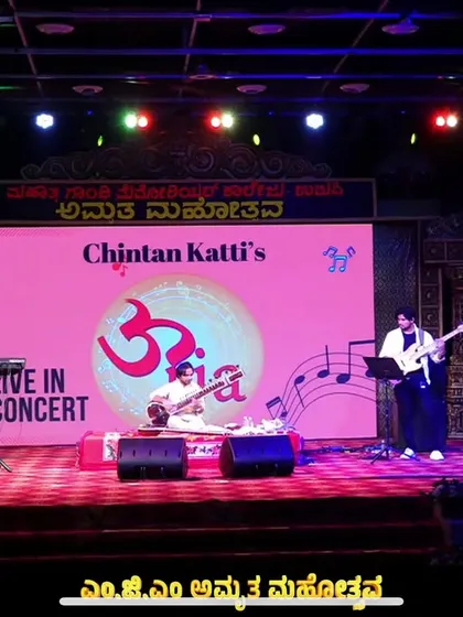 Here is my fusion band 'Urja' live in concert in Udupi. This image captures the scale and energy of our performances, where we blend traditional sitar with drums, bass, and keyboards for a powerful sound.