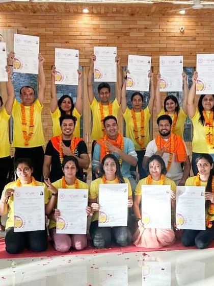Another batch of accomplished yoga teachers, proudly displaying their 300-hour YTTC certificates.
