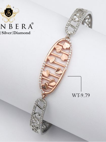 A romantic two-tone bracelet with a charm filled with tiny rose gold hearts. At 9.79 grams, this piece lets your wrist sparkle with the beauty of silver and love.
