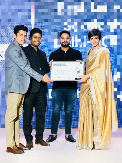 Here I am accepting the Indian Icon of the Year 2023 award, presented by actress Mandira Bedi. It is a privilege to be recognized for my work.