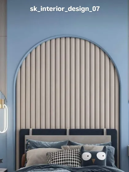 A child's bedroom with a playful yet chic design. The arched, fluted headboard in beige is set against a calming blue wall, with modern pendant lights adding a stylish touch.