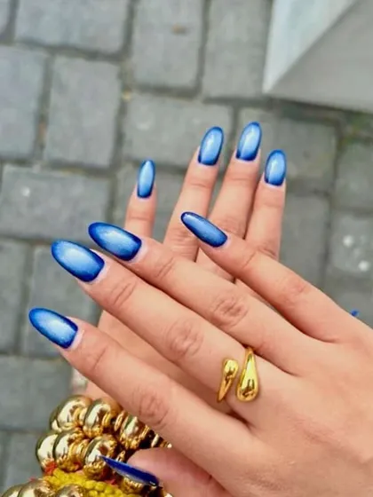 A stunning blue "aura" or cat eye design, with a deep blue border fading into a bright, luminous center.