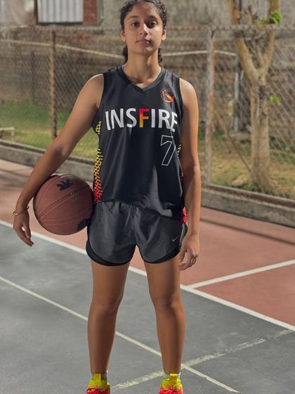 A portrait of one of our dedicated female athletes, focused and ready for the game.