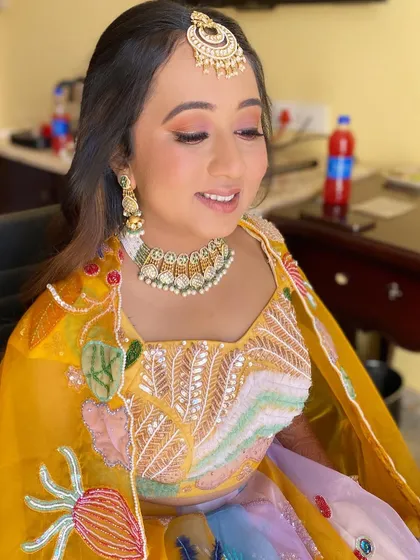 A close-up of Varija's playful and vibrant makeup. The look is perfect for a daytime event, adding a touch of fun and color.