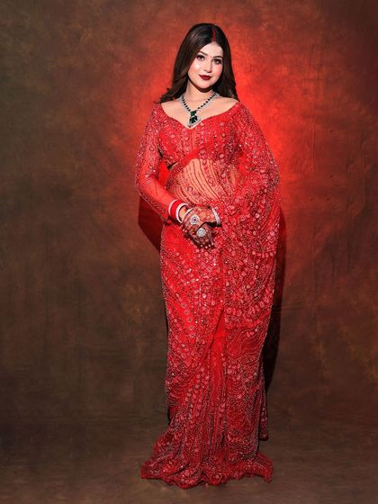 A standing pose in the red sequined saree, perfect for a Karwa Chauth party.