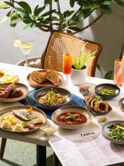 A modern European table spread with various small and large plates. This demonstrates my ability to shoot diverse menus in a clean, bright style.