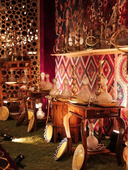 The warm glow of light filtering through intricate jali screens and reflecting off glass decanters. This play of light and shadow added depth and mystery to the Moroccan bazaar.