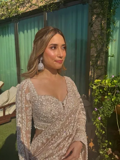 Another angle of this gorgeous half-up, half-down wavy hairstyle. A small clip adds a touch of sparkle while keeping the hair perfectly in place.