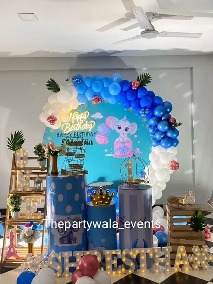A full view of the baby elephant party setup, showing the checkered floor which adds a unique design element to the overall look.