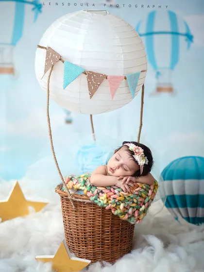 Up, up, and away into dreamland. I love creating whimsical setups like this hot air balloon adventure, turning a simple portrait into a storybook moment.
