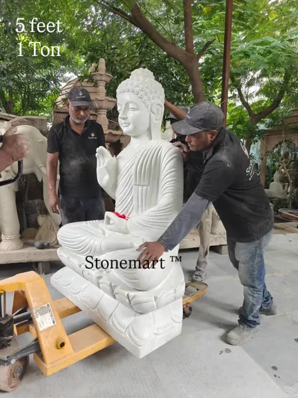 Our artisans preparing the 1-ton white marble Buddha statue for display. This piece is designed as a significant garden sculpture, bringing a sense of peace and grandeur to any large outdoor space.